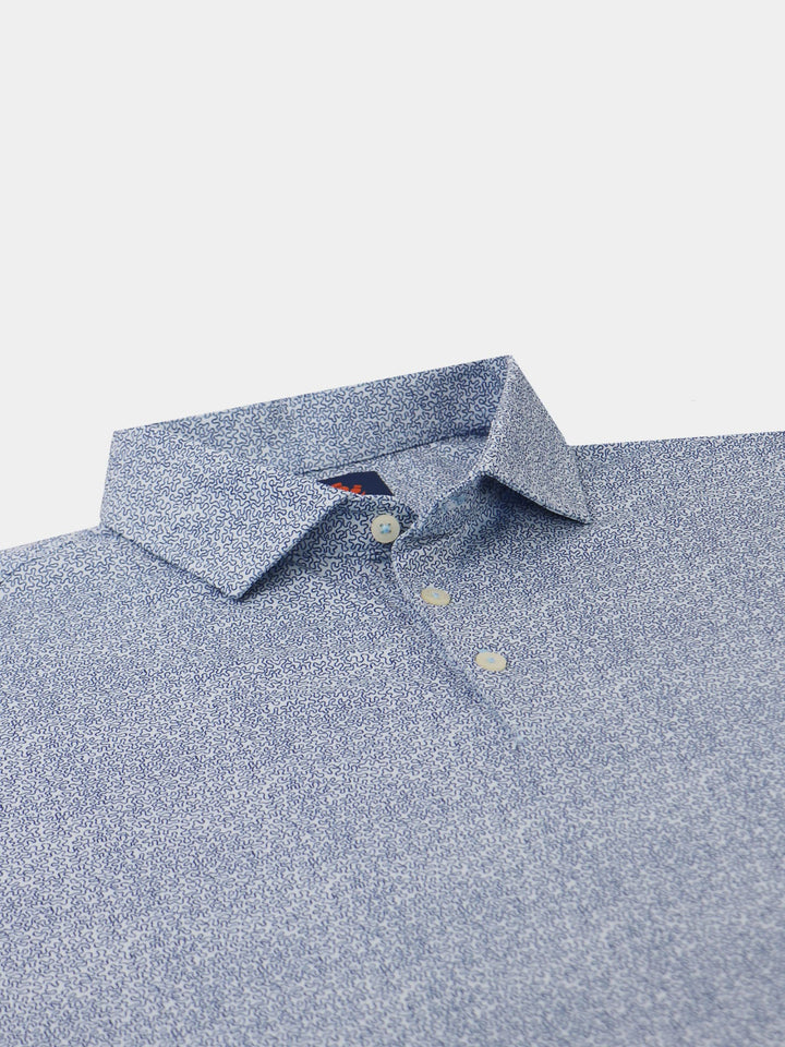A blue patterned dress shirt with a intricate squiggle design and folded collar