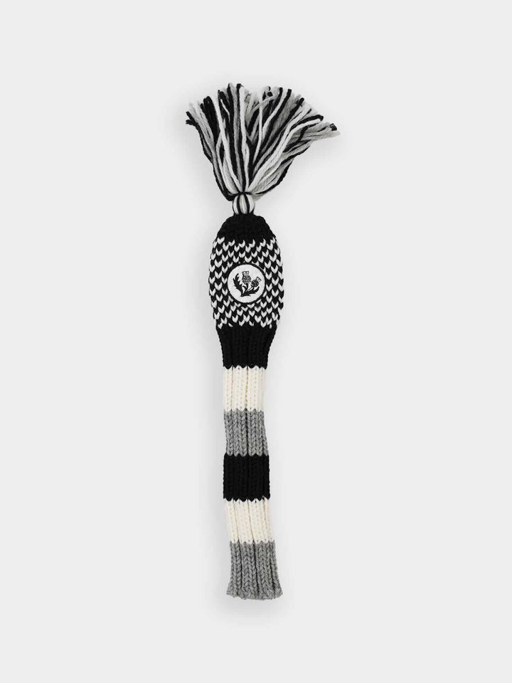 Striped black, white, and gray knit golf club head cover with a pom-pom top