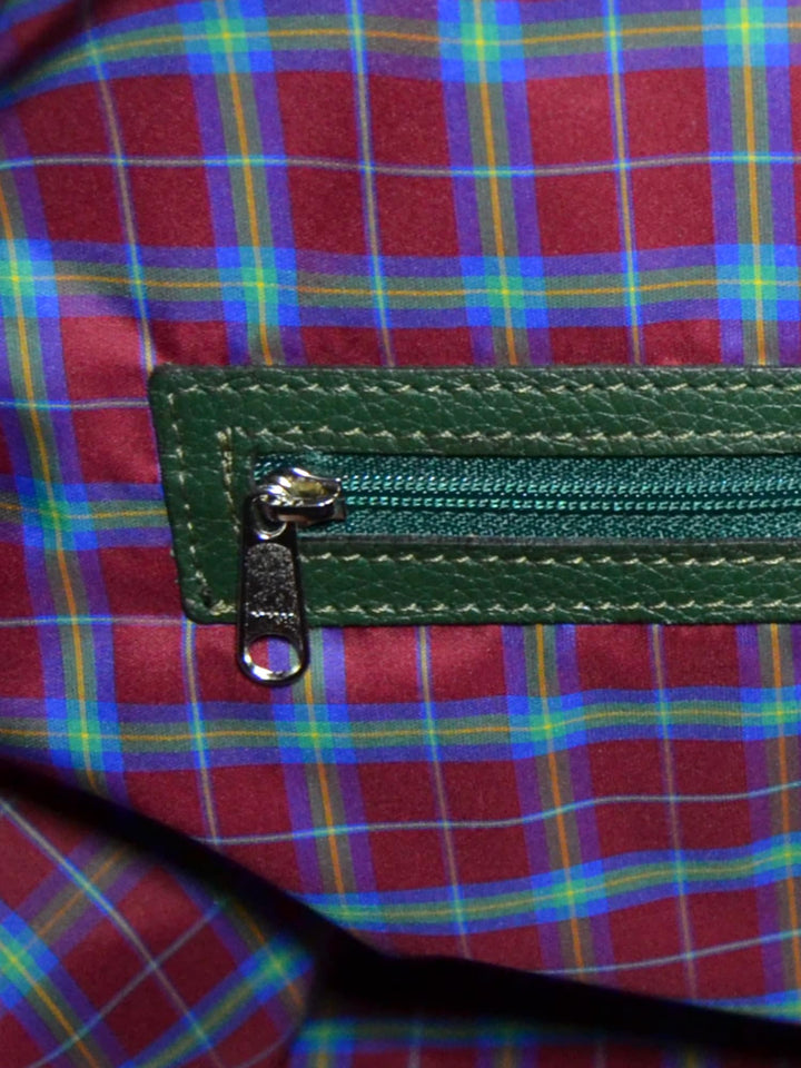 Close-up of a colorful plaid fabric with blue, green, and red squares