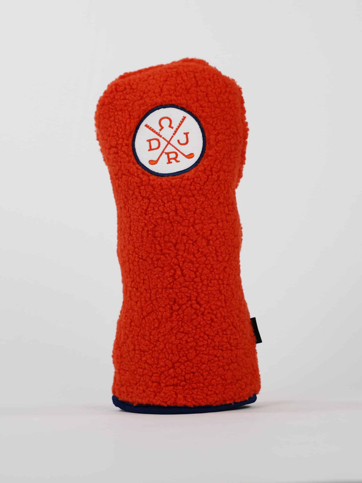Bright orange fleece golf club headcover with a circular Donald Ross logo