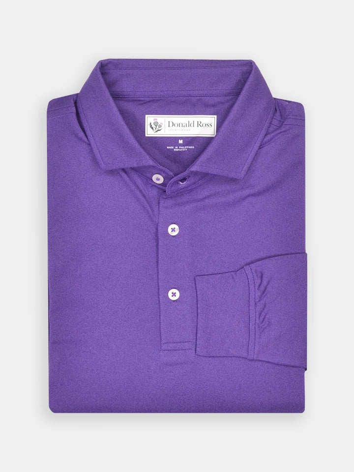 Folded purple polo shirt with a structured collar and three white buttons, neatly arranged against a white background