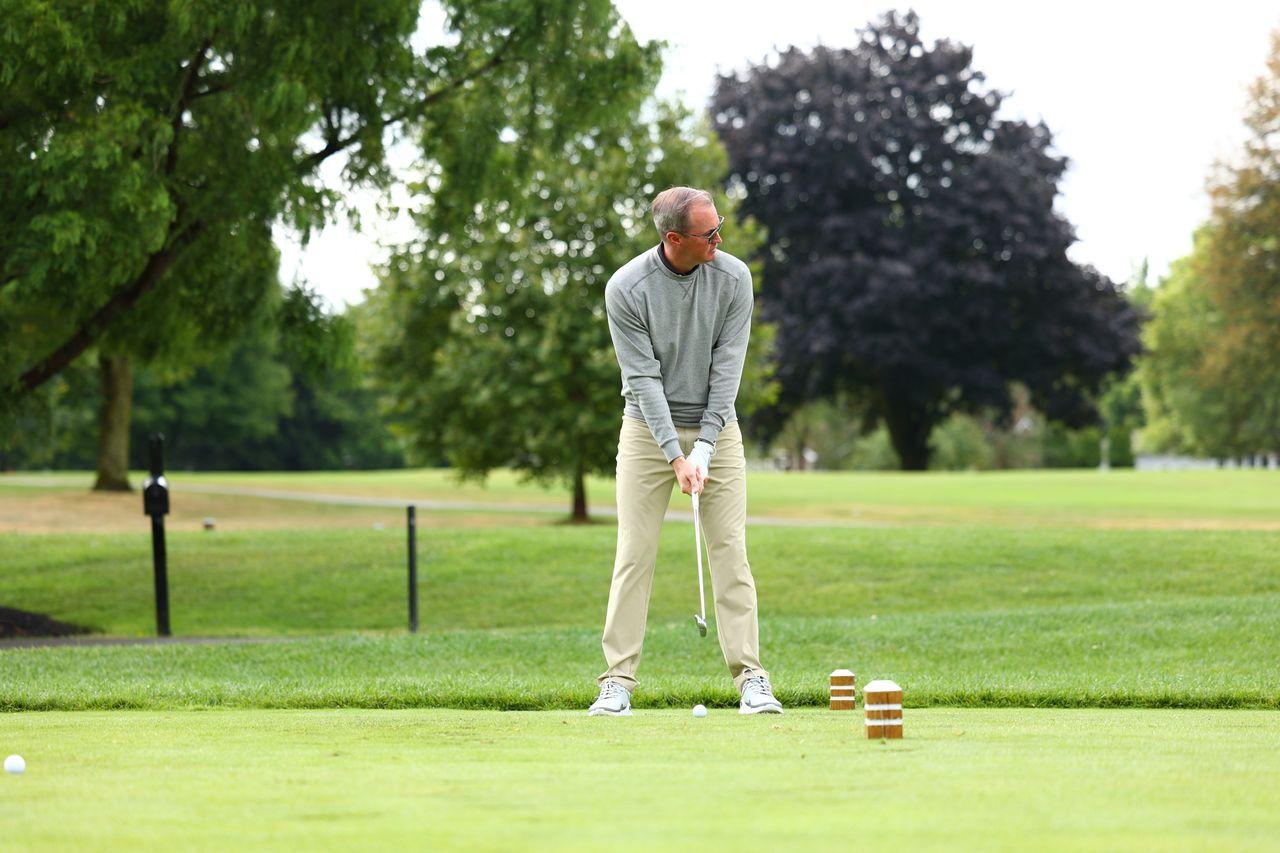 A man wearing Donald Ross Sportswear golfing