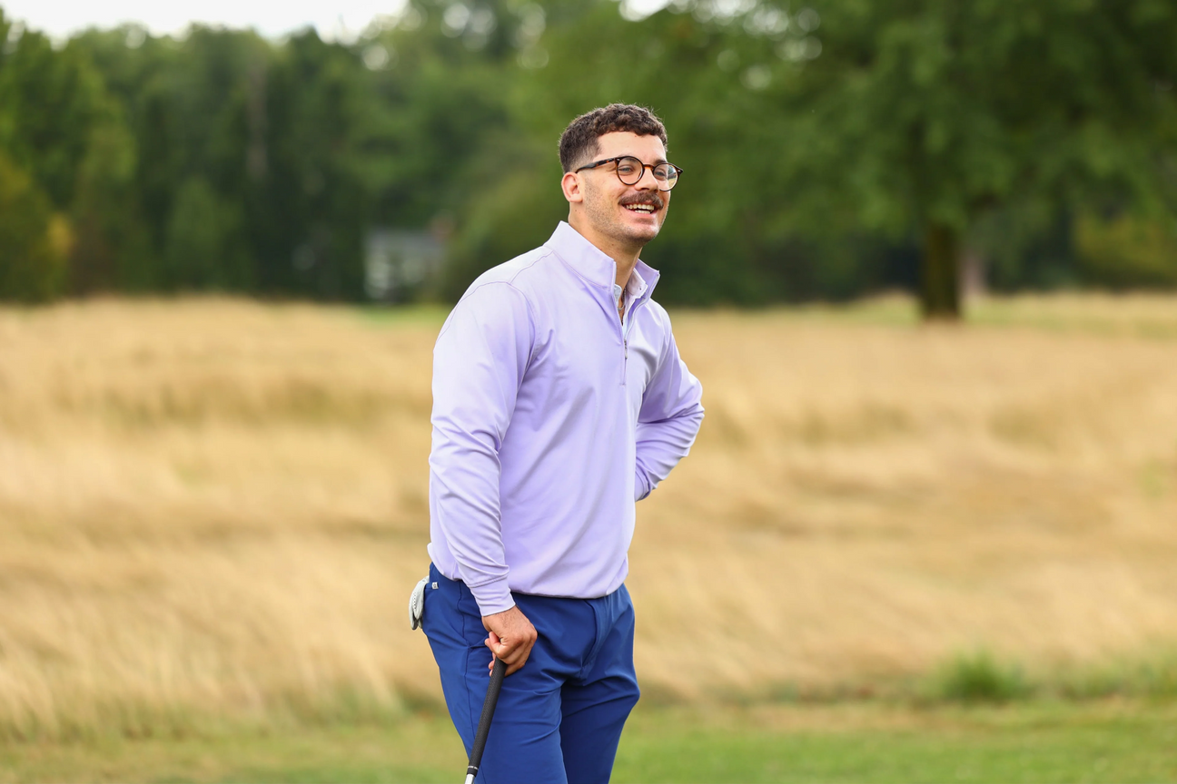 Man golfing at a private golf club in appropriate attire