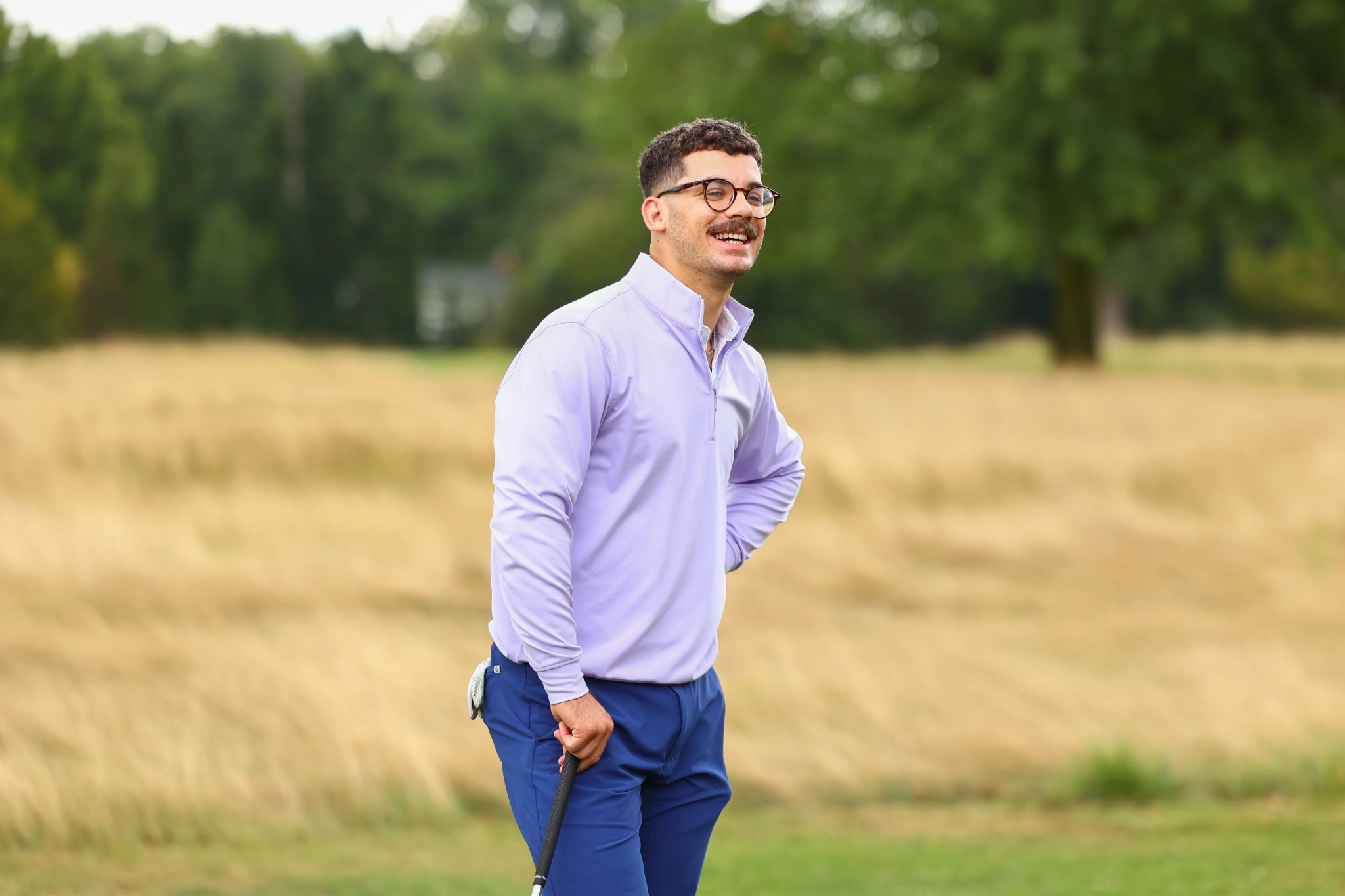 Man golfing at a private golf club in appropriate attire