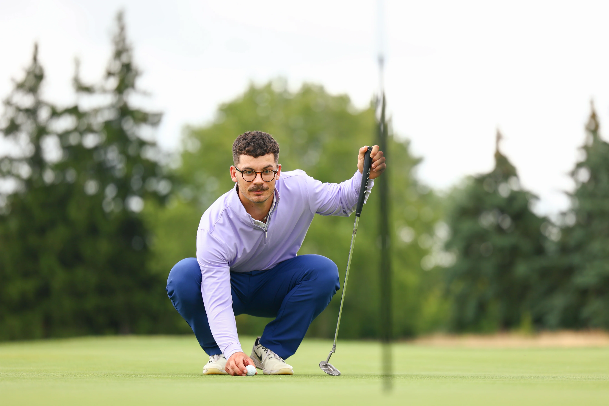 Man golfing wearing Donald Ross Sportswear