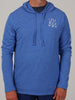 Man wearing a casual, blue hooded sweatshirt with crossed golf clubs and DJR letters printed on the chest, standing against a plain background.