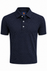 Navy short-sleeve polo shirt with an all-over white dot pattern and white button placket.