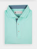 Folded light teal golf polo shirt with a blue-striped collar and three buttons