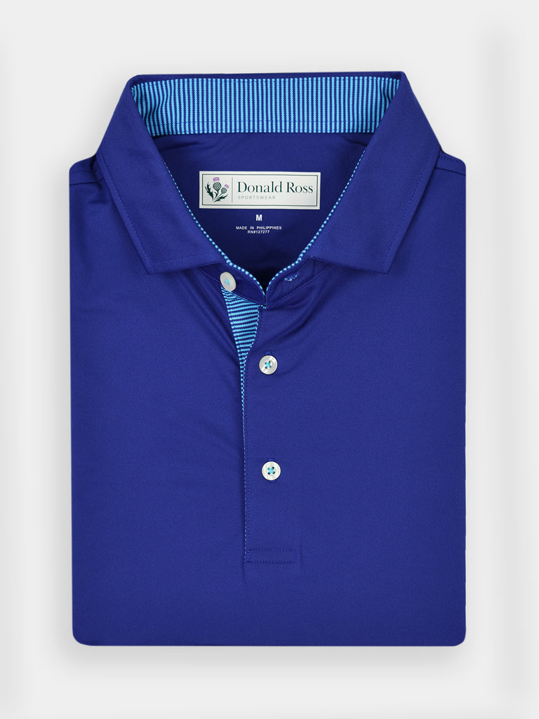 Folded royal blue golf polo shirt with a striped collar, displaying three white buttons