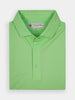 Folded lime green polo shirt for golf professionals