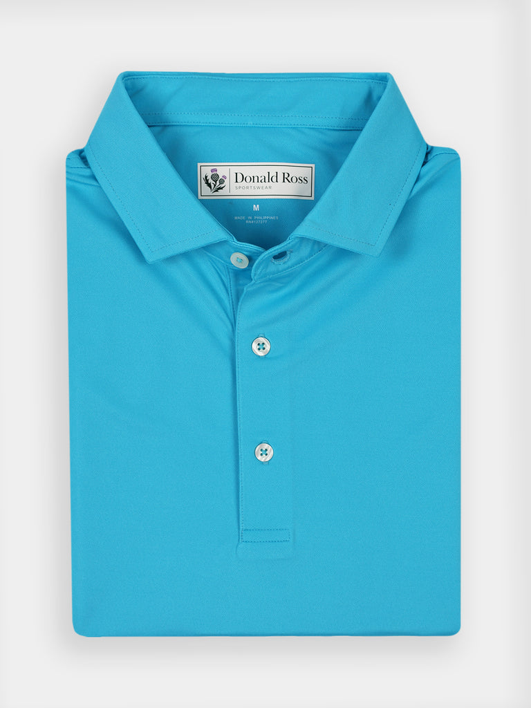 Folded turquoise golf performance polo shirt featuring moisture-wicking fabric