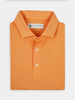 Folded bright orange performance polo shirt with a collar and three buttons