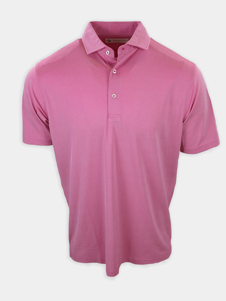 A short-sleeved pink polo shirt is displayed against a neutral background.