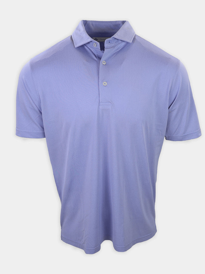 A lilac short-sleeve polo shirt with a collar and three buttons is displayed against a plain background.