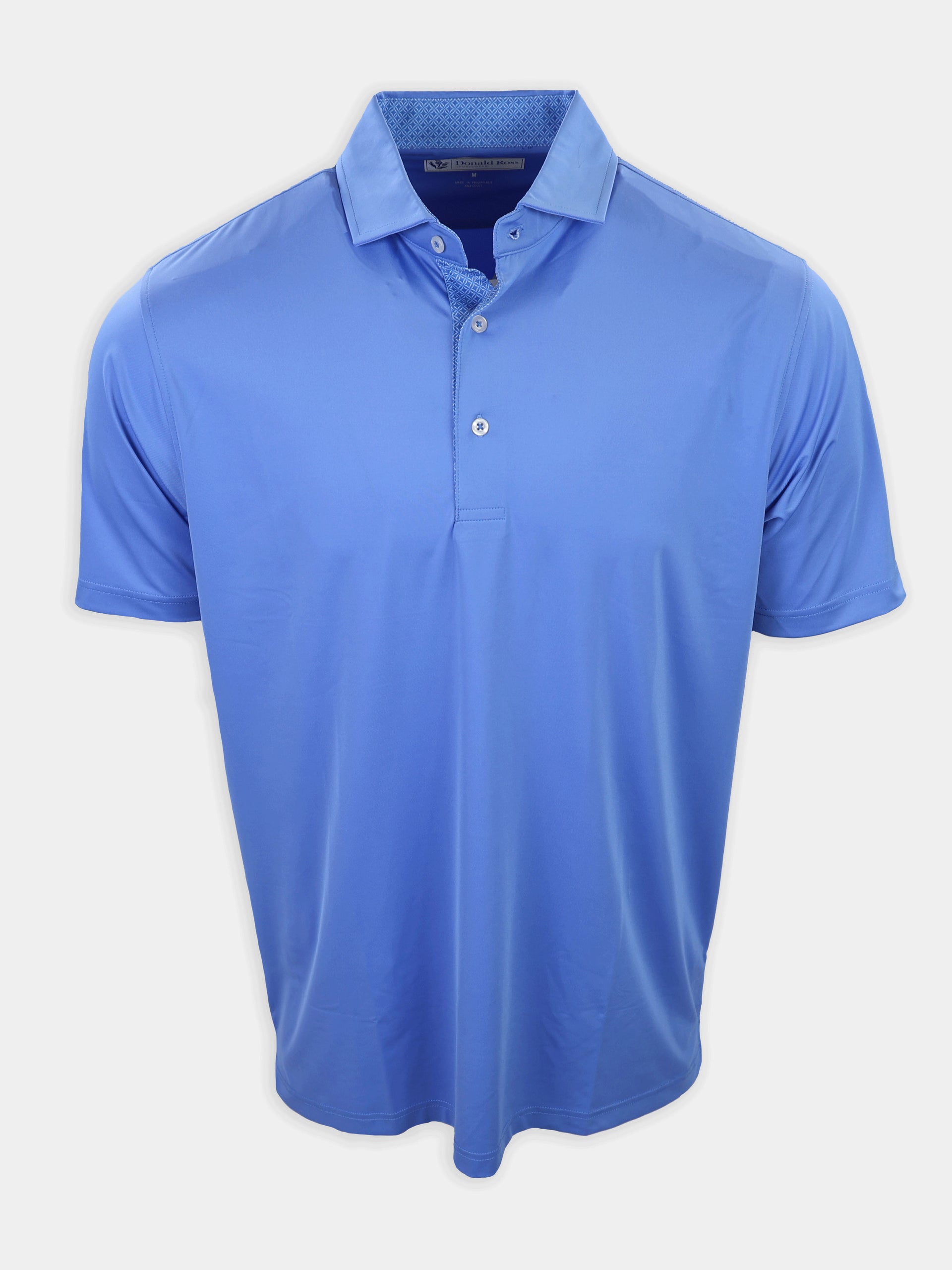 Light blue polo shirt with a folded collar and three visible buttons at the neckline.