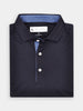 Navy polo shirt neatly folded, featuring a subtle blue patterned interior collar and white buttons