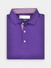 A neatly folded, vibrant purple polo shirt with a patterned inner collar is displayed against a light background