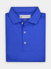 Folded blue polo shirt with relaxed and stretchy performance fabric for golfers that prefer a relaxed fit