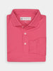 Folded pink polo shirt with a collar and three buttons