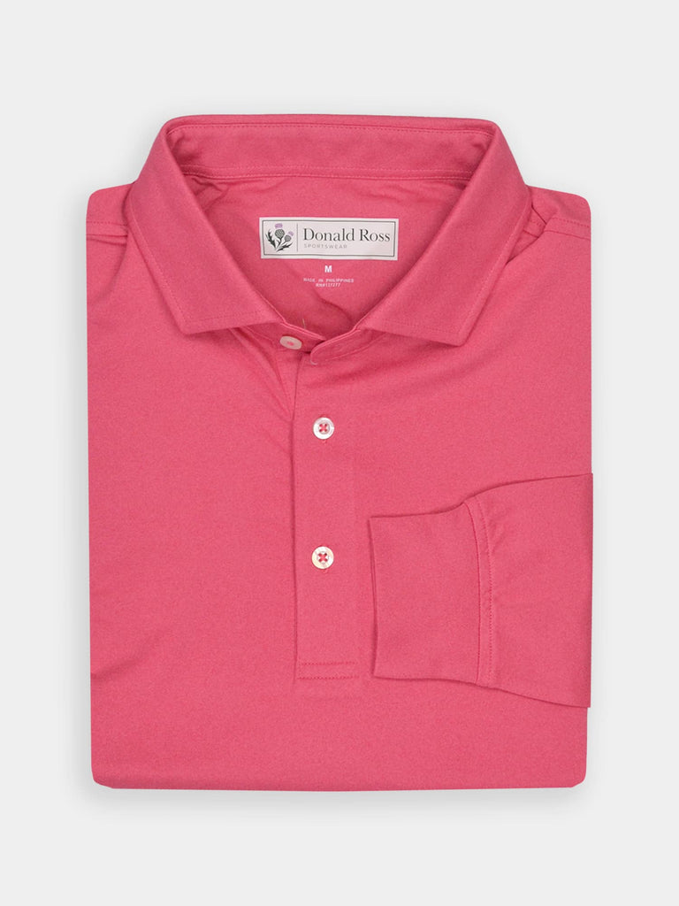 Folded pink polo shirt with a collar and three buttons