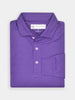 Folded purple polo shirt with a structured collar and three white buttons, neatly arranged against a white background