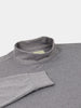 Gray mock neck sweater on a white background, featuring long sleeves and a soft, textured fabric, conveying a cozy and casual vibe.