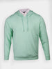 Mint green golf hoodie with drawstrings layered over a white collared golf polo shirt.