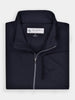 Folded black wind shell jacket with a standing collar, perfect for layering on windy days