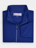 Folded blue full-zip wind shell jacket for golfers made by Donald Ross