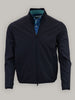 A dark navy jacket is displayed with a zippered front and a blue patterned shirt visible underneath.