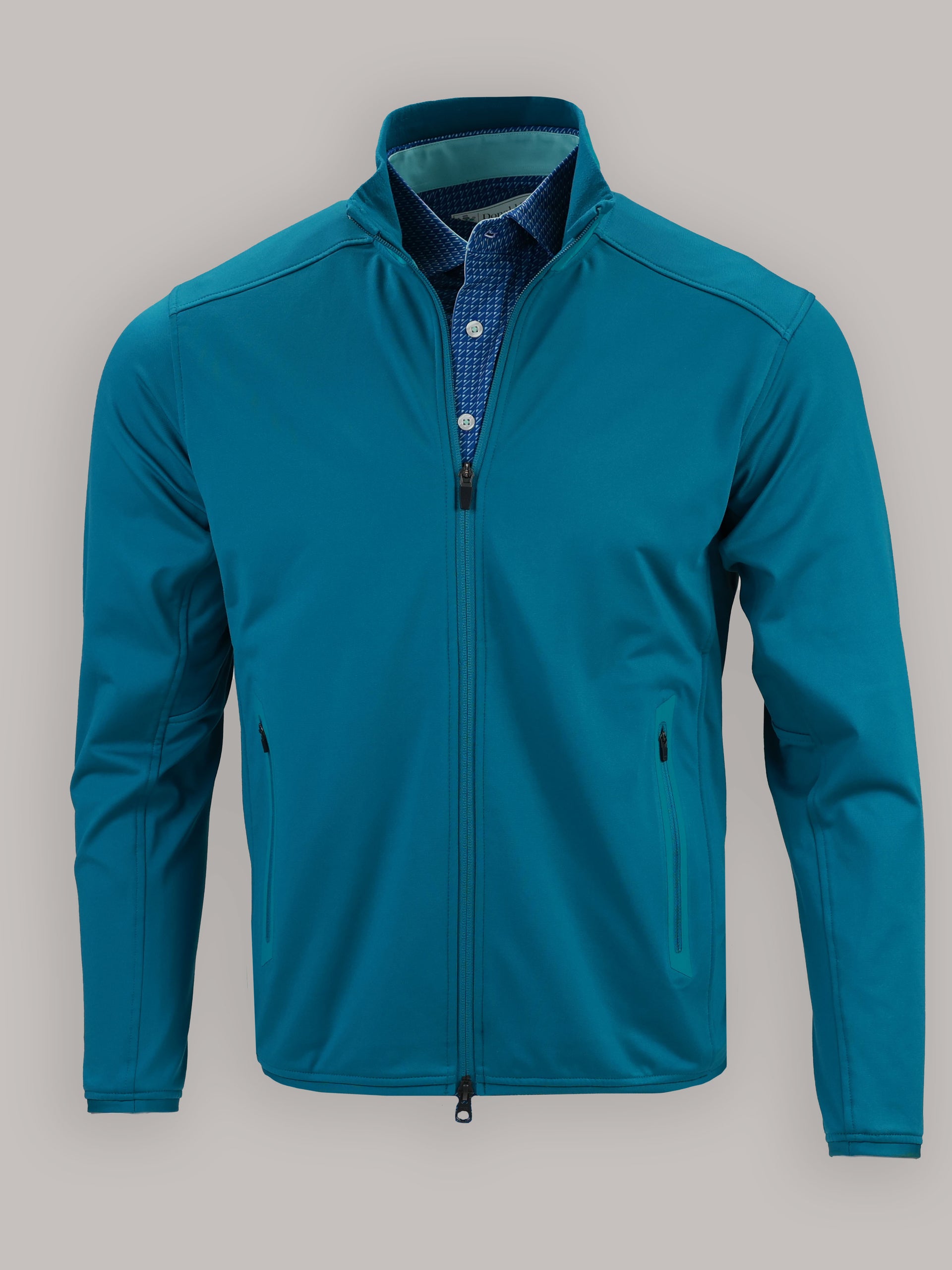 Teal jacket with a zippered front and two side pockets displayed against a neutral background.