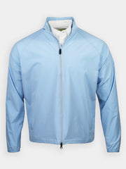 Light blue, full-zip jacket over a white collared shirt. The jacket has a high collar and long sleeves.