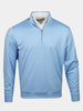 Light blue, long-sleeve pullover shirt with a quarter-zip front, worn over a white collared shirt