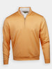 Orange quarter-zip pullover with a high collar against a white background. The pullover is worn over a white collared shirt, creating a casual, stylish look.