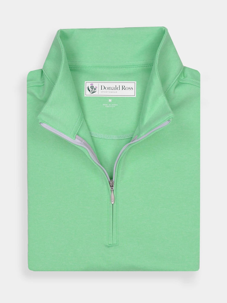 Folded mint green half-zip pullover with a white inner lining