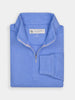 A folded light blue quarter-zip sweater with performance fabric for golf enthusiasts