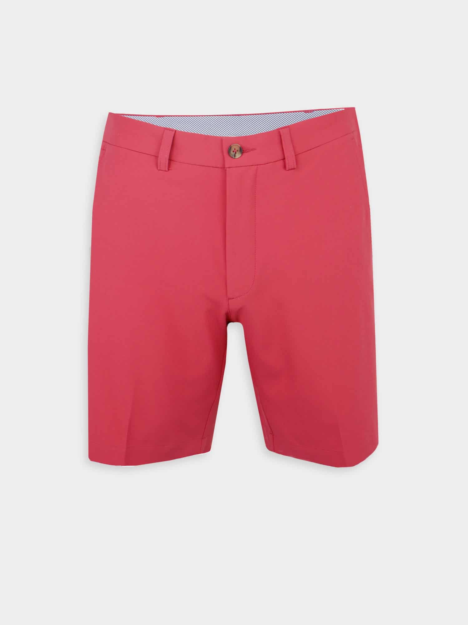 Red tailored performance golf shorts with belt loops and a button closure against a white background. The style is crisp and summery, conveying a casual vibe.