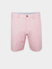 Light pink performance walker golf shorts with a single brown button at the waist, belt loops, and a subtle fabric texture