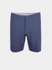 Blue performance golf walker shorts are shown against a plain white background. They feature a button closure, belt loops, and a clean, tailored design, conveying a casual yet polished look.