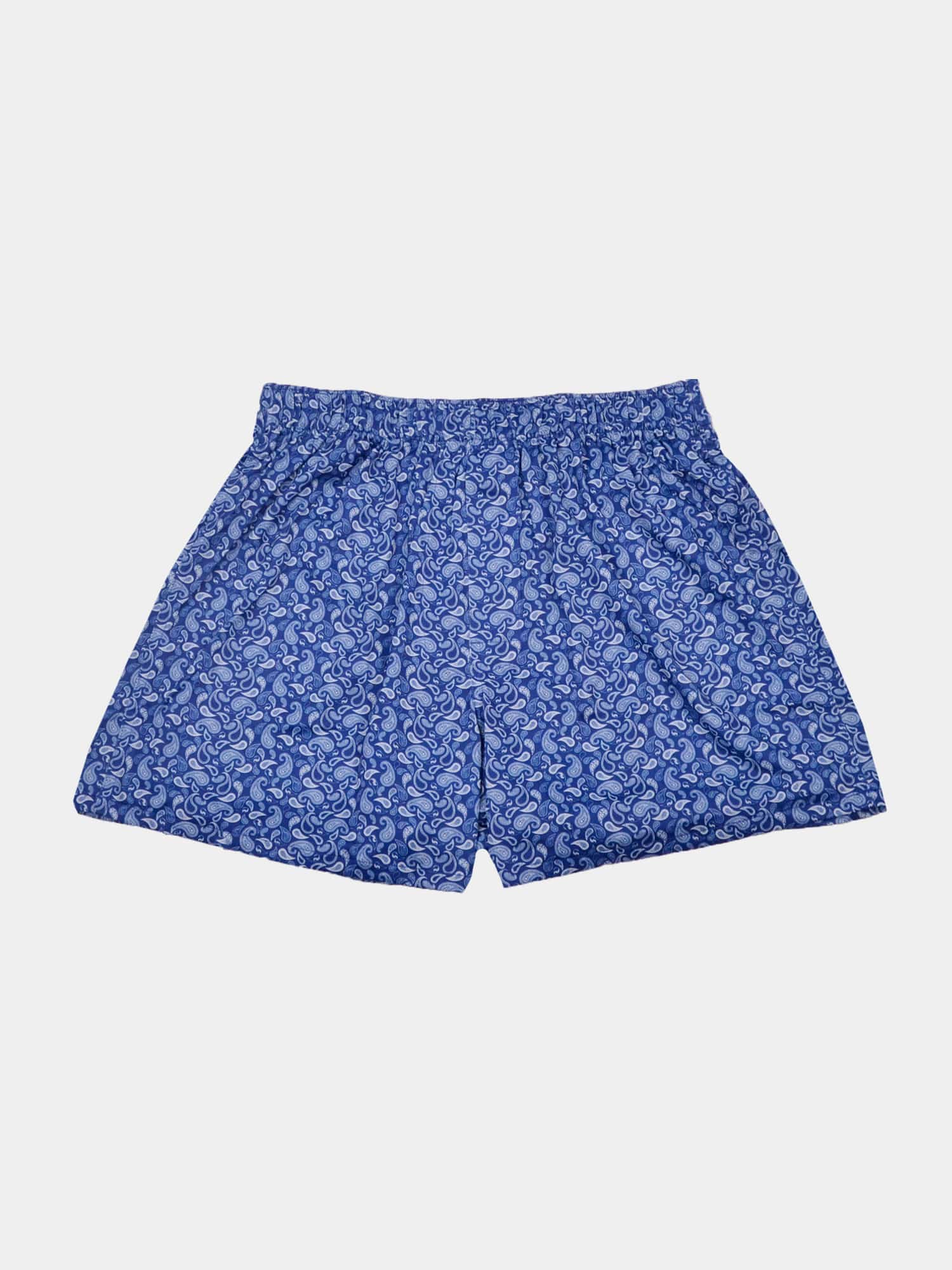 Blue paisley boxer shorts with an elastic waistband, featuring a white swirling pattern