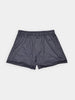 Dark blue scallop paisley men's boxer shorts with an elastic waistband, laid flat on a plain white background