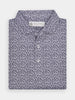 Folded black and white flame patterned polo shirt, featuring intricate designs. The fabric appears soft and comfortable, conveying a casual and stylish tone.