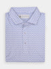 Folded white polo shirt with a small blue pepper pattern, featuring a label near the collar