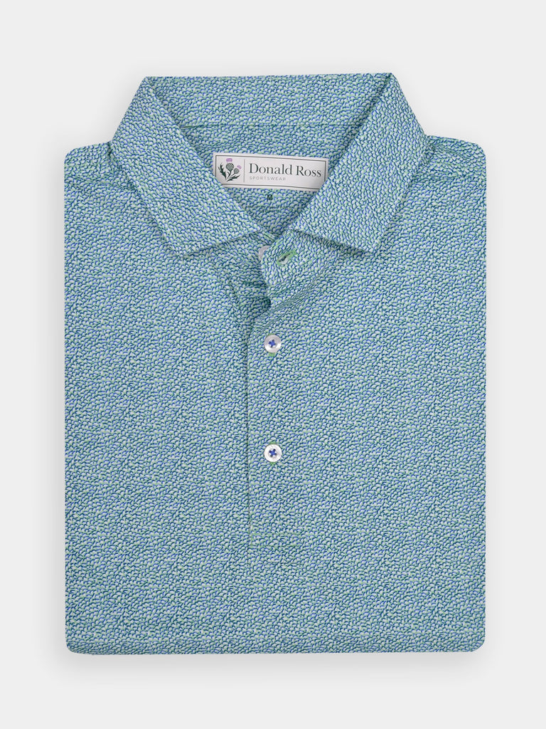 Folded blue patterned polo shirt with a textured design and three buttons