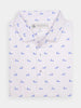 White polo shirt with small blue man and dog pattern, neatly folded. The shirt features a subtle, elegant design and a collared neckline.
