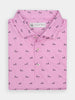 Folded pink polo shirt with a pattern of small black dog-walking silhouettes