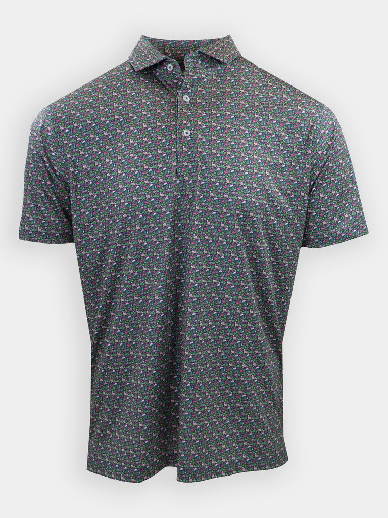 A short-sleeve polo shirt with a black background featuring a colorful floral pattern is displayed.