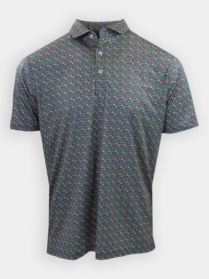A short-sleeve polo shirt with a black background featuring a colorful floral pattern is displayed.