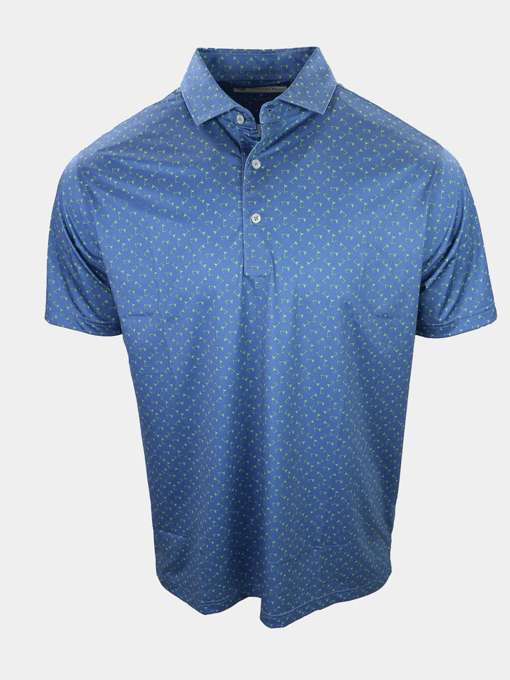 A blue polo shirt with a pattern of small green shapes is displayed.