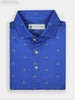 Folded blue polo shirt with small green embroidered patterns, featuring a neat collar and three buttons